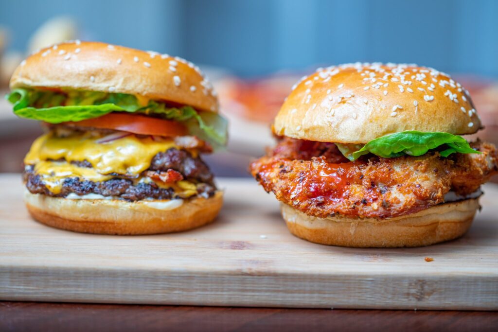 Commerical Photography - Two burgers presented on a serving board.